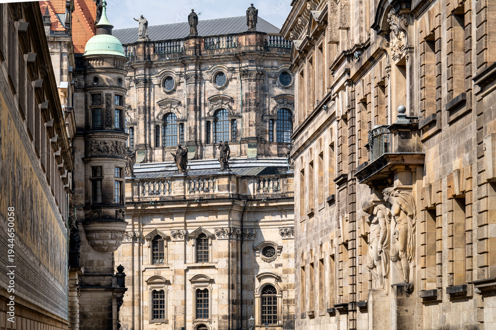 Fototapeta premium Baroque architecture with sculptures and detailed facades near the Hofkirche in Dresden. Ideal for architecture and culture themes.