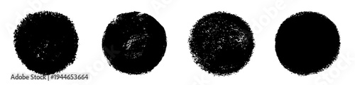 Set of black grunge circle stamps isolated on white background. Rough round ink marks with distressed edges, textured brush effect, speckled surfaces and varied opacity in four different styles.