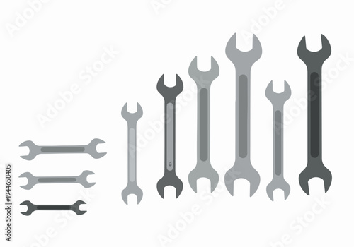 Flat design vector set of open-end wrenches in varying sizes and gray tones, isolated on white background.