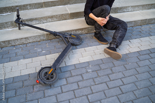 Photos Closeup shot of man fell from electric scooter and injuring his leg