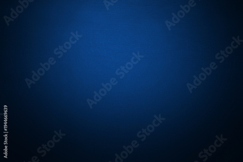 Deep navy blue gradient background with soft vignette and subtle light center. Dramatic backdrop for modern design, technology presentations, luxury branding, elegant wallpaper. Ombre, blur effect