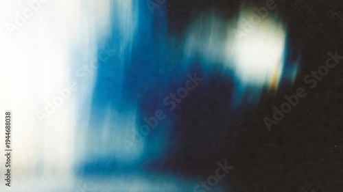 Abstract blue and white gradient background with fluid motion blur, creating a contemporary and artistic texture