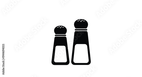 Black salt and pepper shakers displayed as a striking silhouette