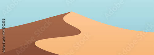 A gradient sand dune with a blue sky background