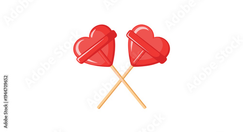 Two red heart-shaped lollipops on wooden sticks crossed over each other symbolizing love and sweet affection for Valentine's Day celebrations.