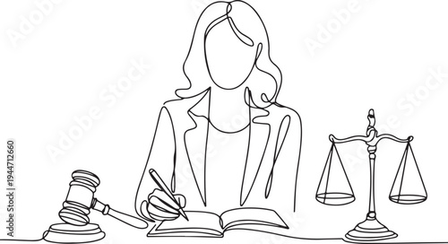 Lawyer writing in book with gavel and scales of justice
