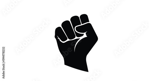 Raised fist symbolizing power resistance and solidarity a stark silhouette