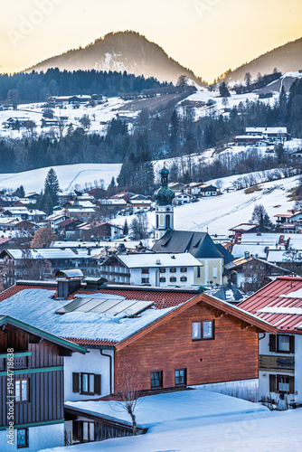 Reit im Winkl winter sports resort, view of the town with church at sunset