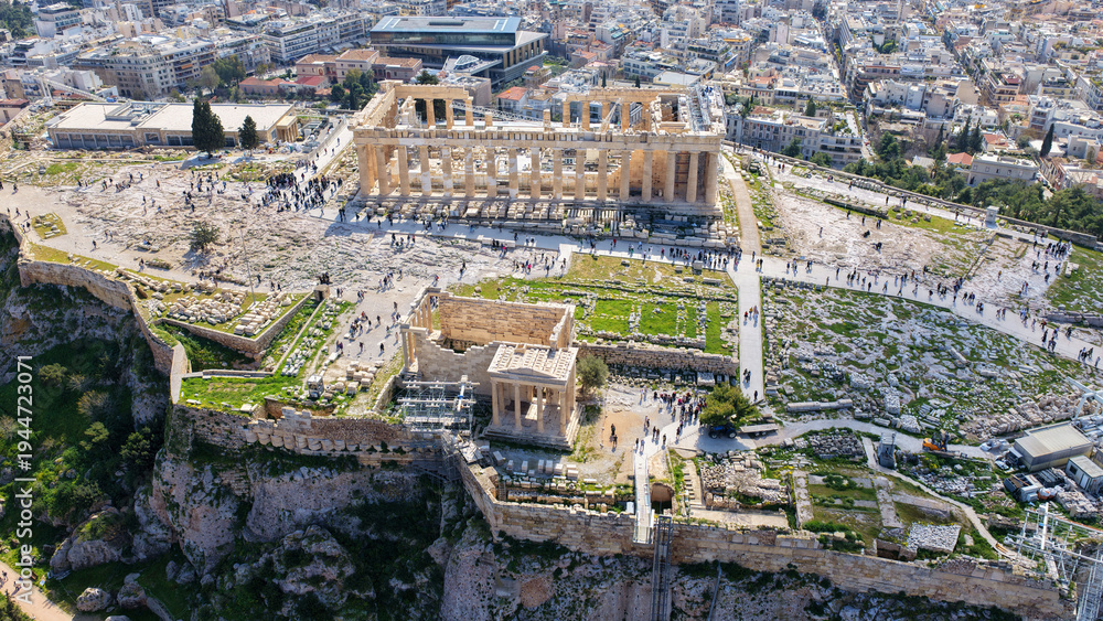 Fototapeta premium Aerial drone photo above Acropolis hill and the Parthenon featuring Propylaea and porch of the Caryatids, Athens historic centre, Attica, Greece