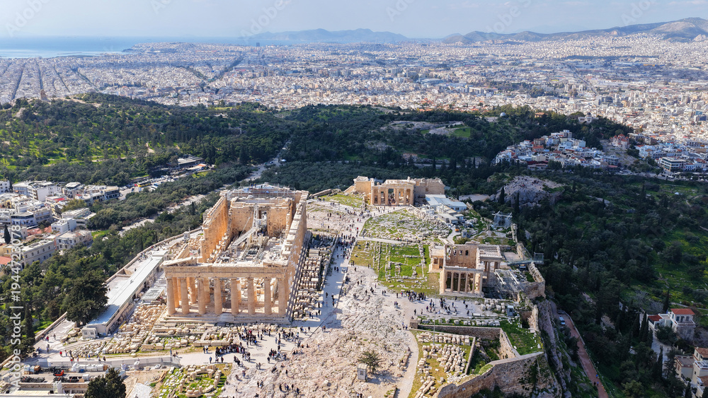 Fototapeta premium Aerial drone photo above Acropolis hill and the Parthenon featuring Propylaea and porch of the Caryatids, Athens historic centre, Attica, Greece