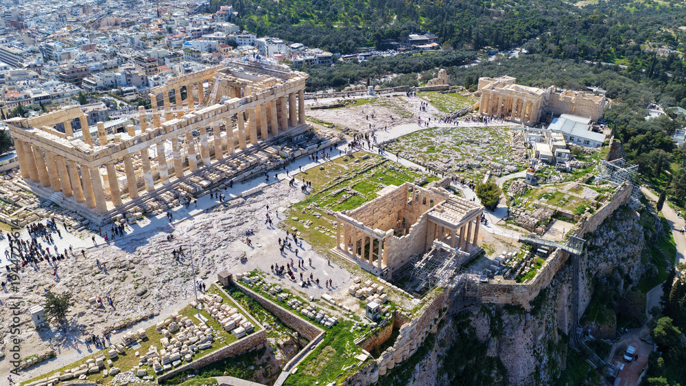 Fototapeta premium Aerial drone photo above Acropolis hill and the Parthenon featuring Propylaea and porch of the Caryatids, Athens historic centre, Attica, Greece