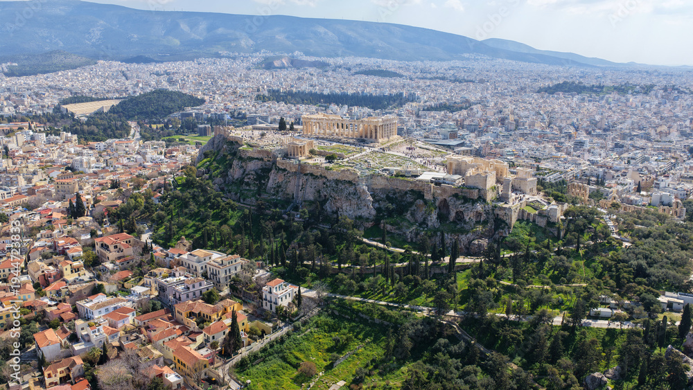Fototapeta premium Aerial drone photo above Acropolis hill and the Parthenon featuring Propylaea and porch of the Caryatids, Athens historic centre, Attica, Greece
