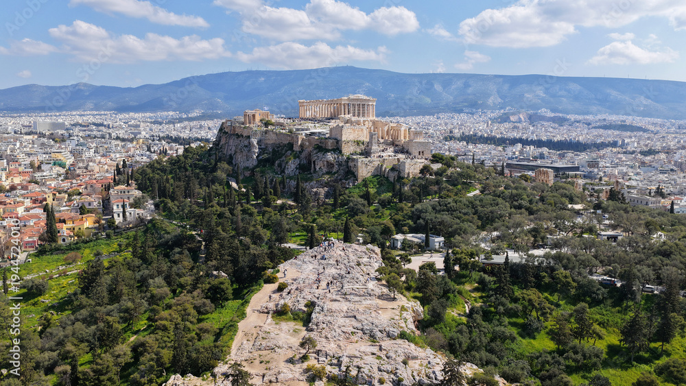 Fototapeta premium Aerial drone portrait photo of iconic Areopagus hill with great views to Acropolis and The Parthenon, Athens historic centre, Atttica, Greece
