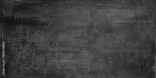 Dark charcoal gray grunge texture background, black distressed cement wall with weathered paint and vintage brush marks