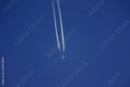 High-speed massive aircraft leaving contrails behind