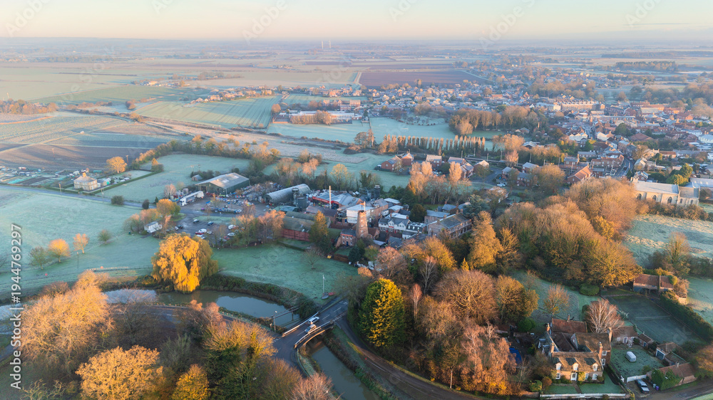 Fototapeta premium Rural farmland and English village town, Lincolnshire. Sunset in the countryside