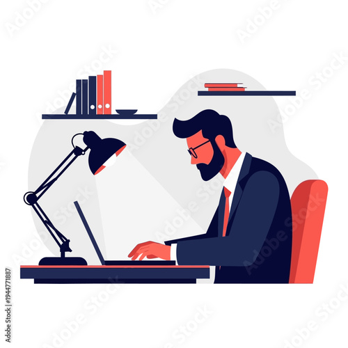 Man working on laptop at desk with desk lamp and books, focused professional