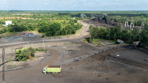 Foto Drone footage from a coal mining site in South Kalimantan shows trucks and heavy