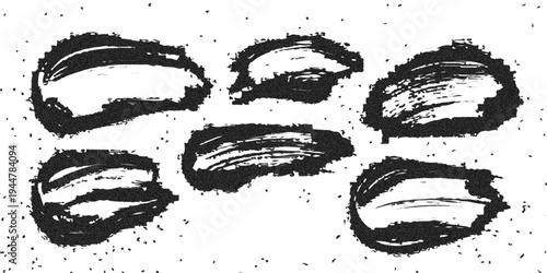 Set of hand drawn ink grunge and splashes featuring black grunge brush textures, paint splatters and stain for a dirty  design element.