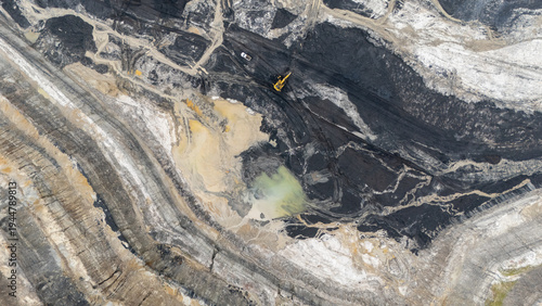 Foto Drone footage from a coal mining site in South Kalimantan shows trucks and heavy