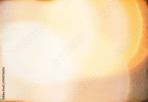 Obraz na plátně Soft warm light leak abstract background with film grain and bokeh glow