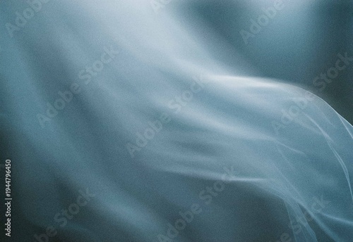 Flowing translucent blue fabric motion blur with soft grain and light