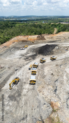 Drone footage from a coal mining site in South Kalimantan shows trucks and heavy equipment in action