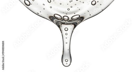 Clear transparent viscous liquid gel or serum with air bubbles flowing down isolated on white background