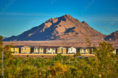 Tableau sur toile Desert Mountain Sunrise and Suburban Homes with Greenery in Henderson Nevada