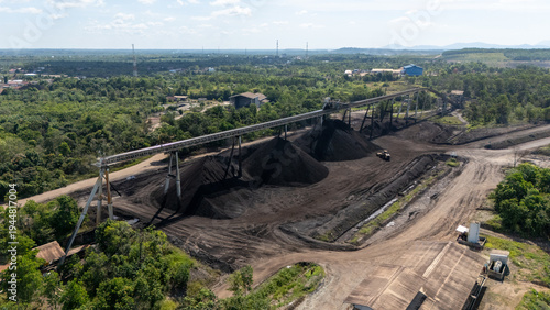 Foto Drone footage from a coal mining site in South Kalimantan shows trucks and heavy