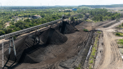 Schilderij op canvas Drone footage from a coal mining site in South Kalimantan shows trucks and heavy