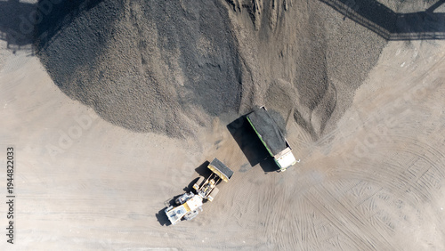 Bild auf Leinwand Drone footage from a coal mining site in South Kalimantan shows trucks and heavy