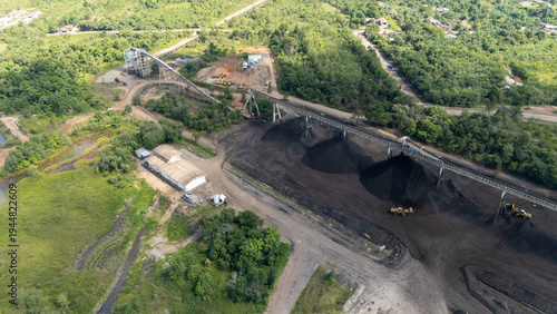 Tableau sur toile Drone footage from a coal mining site in South Kalimantan shows trucks and heavy