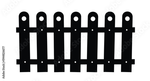 Black fence with regularly spaced posts a stark graphic silhouette
