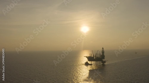 Aerial view of offshore jack up rig and offshore platform for oil and gas exploration and production. 
