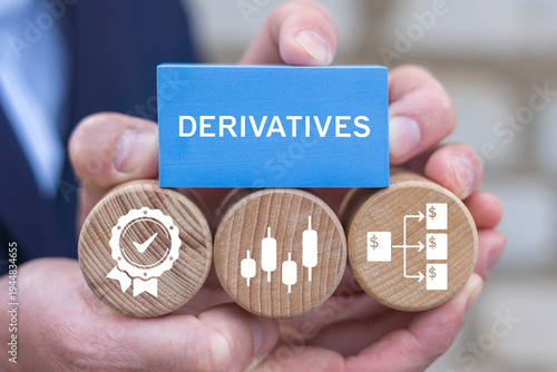 Concept of derivatives. Person holding blocks with icons sees the text DERIVATIVES. Derivative Bond Asset Contract Investing.