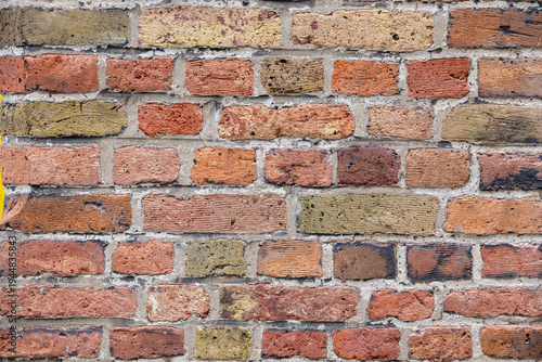 Old colorful brick wall surface in bruges, belgium