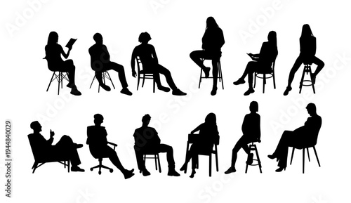 A group of people sitting in various chairs in a meeting or discussion setting