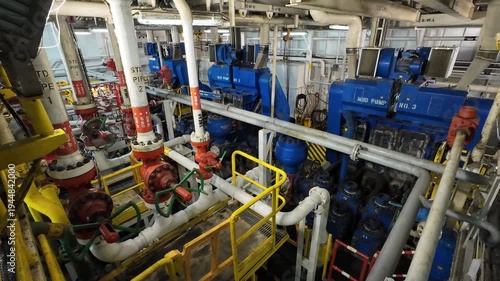 Triplex mud pumps for oil drilling rig in the pump room. A mud pump is one of the most important equipment on the rig.
