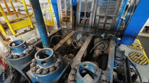 Triplex mud pumps for oil drilling rig in the pump room. A mud pump is one of the most important equipment on the rig.
