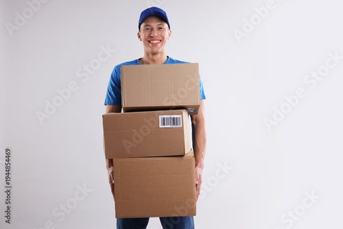 Photos Mover service worker with cardboard boxes on light grey background