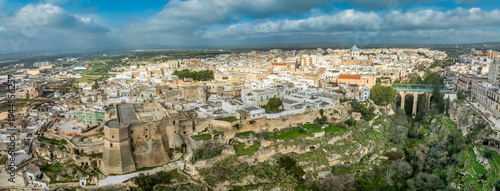 Schilderij op canvas Aerial panoramic view of Massafra, medieval hilltop town with castle above the r