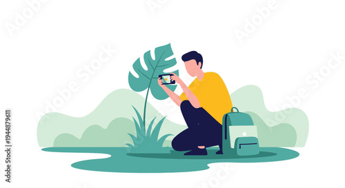 A man sits on a chair taking a photo of a plant with a camera in a natural setting.