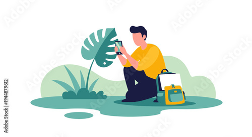 Man sits on ground with yellow bag and uses phone near large leafy plant