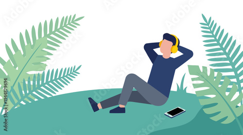 A person wearing headphones sits on a green hill listening to music next to a phone surrounded by large leaves.