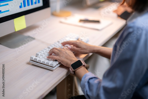 Photos Woman typing on modern keyboard, working on business data