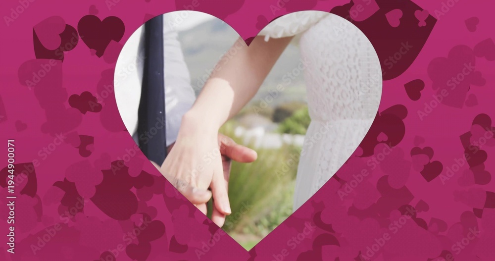 Naklejka premium Holding couple wearing white lace dress and dark jacket embracing in outdoor hills, heart frame