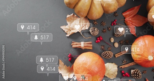 Showing small orange pumpkin cluster and autumn props on dark gray surface with notification-icons