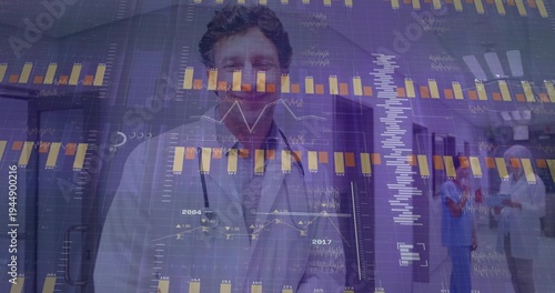 Standing physician wearing white coat and stethoscope in hospital corridor, charts overlaying