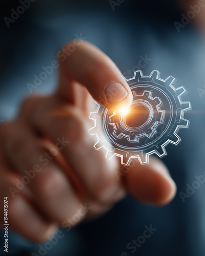 Wallpaper Mural Technological Touch: A hand delicately interacts with a glowing, digital gear, symbolizing innovation and technological advancement. Torontodigital.ca